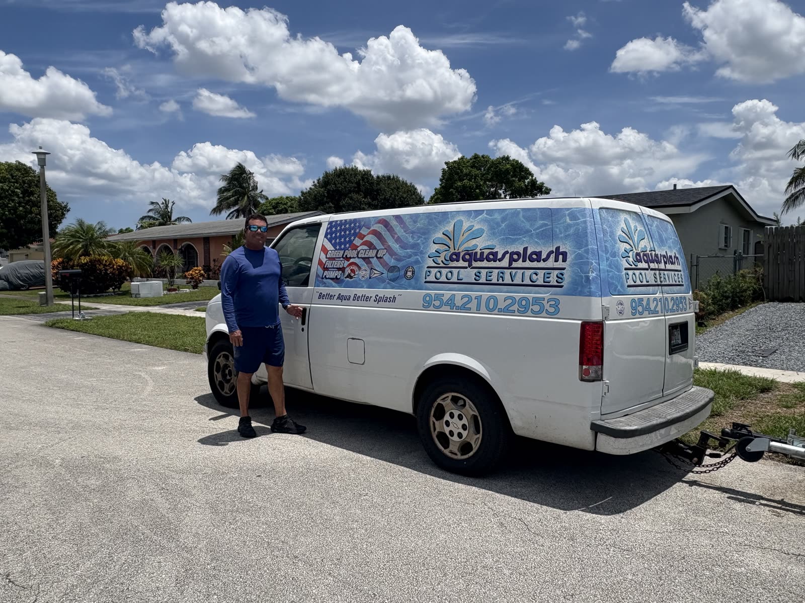 Javier Fernandez, owner of AquaSplash Pool Services, with the service van